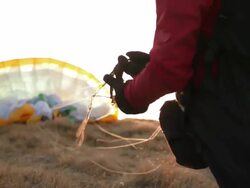 HD: Paraglider Preparing Parachute Stock Footage