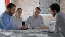 Restaurant employees discuss paperwork with boss in staff meeting Stock Footage