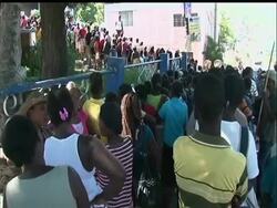 Hundreds of people pushed and shoved outside one of the National Identification Office centres in the Haitian capital Port au Prince on Thursday, anxious to get their identification cards to enable them to vote in Sunday's elections. News Clip