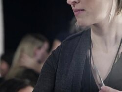 CU PAN Female makeup artist backstage at fashion show applying make-up  Stock Footage