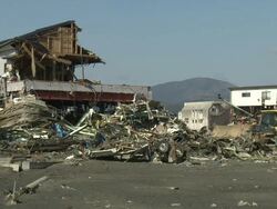 Damage in port area of Kesennuma City, Japan filmed on 1 April 2011, 3 weeks after a tsunami which was caused by magnitude 9 Tohoku earthquake off north east Japan / AUDIO Stock Footage