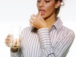 HD: Woman Taking a Pill Stock Footage