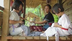 Karen's family is weaving and sewing Stock Footage