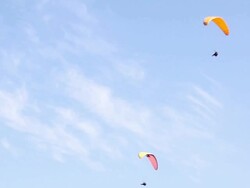 Four paragliding flying in the sky Stock Footage