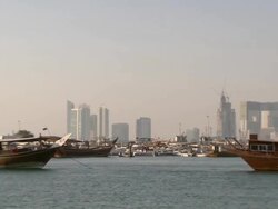 WS PAN View of Modern buildings in Doha and boats floating on the sea / Doha, Qatar  Stock Footage