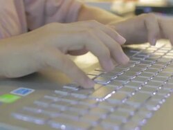 woman Typing at Keyboard,Dolly shot Stock Footage