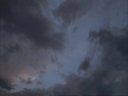 T/L clouds passing overhead, night turning in Stock Footage