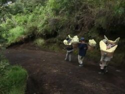 WS Miners carrying solid sulfur from the Ijen volcano / Ijen, Java, Indonesia Stock Footage