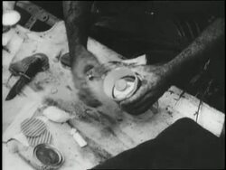 Medics tend to injured soldiers lying on the ground. News Clip