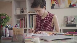 4K: Young Woman Coloring Book In Her Office. Stock Footage