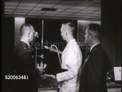 1963: UNITED STATES AIR FORCE ACADEMY: MS Dean of Faculty (unconfirmed) speaking w/ engineer instructor in classroom, male General speaking to camera about teaching social sciences & engineering. Colorado, CO, Rampart Range Instructional Video
