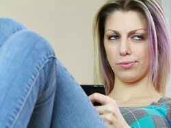 Woman sending text message with cell phone Stock Footage