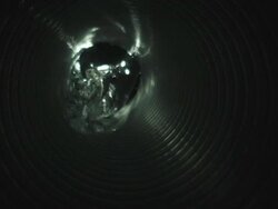 CU SLO MO Shot of cross section of water as it gushes down pipe / United Kingdom Stock Footage