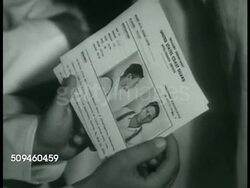 1938: COAST GUARD INVESTIGATION: DRAMATIZATION: Commander Stephen S. Yeandle w/ others in office. Coast Guard sailor being handed  Arrest Record cards. 'US Coast Guard Barracks' sign, Investigators Lindsey & Peters talking about 'Whitey Smith' Instructional Video