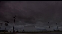 Dark storm clouds drift over a highway in Oklahoma. Stock Footage