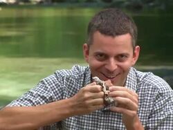 HD: Eating Chocolate By The River Stock Footage