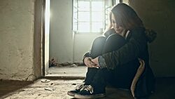 Depressed teenage girl in an abandoned house Stock Footage