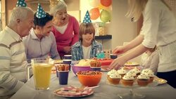 Birthday boy blowing out candles for his tenth birthday Stock Footage