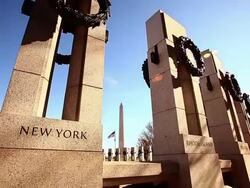 Tilt shot of New York pillar at the World War II Memorial in Washington DC with lens flare Stock Footage