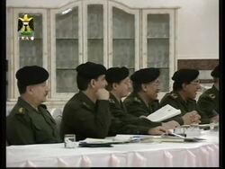 Iraqi TV shows pictures of Saddam in cabinet meeting. News Clip