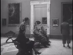 1940: VATICAN CITY MUSEUMS (Musei Vaticani): People sitting in Loggia di Raffaello in Pinacoteca (Art Gallery), LS Two men standing before HUGE Raffaello (Raphael Sanzio) painting 'The Transfiguration' Instructional Video