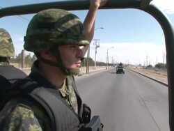 MS PAN TU TD Shot of Mexican army survey of streets as they drive through AUDIO / Ciudad Juarez, Juarez, Mexico Stock Footage