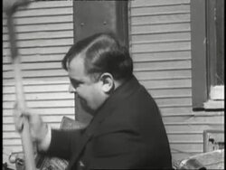 New York City Mayor Fiorello LaGuardia uses a sledgehammer to smash slot machines. News Clip
