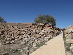 Agrigento, people walking through the outer walls of Agrigento Stock Footage