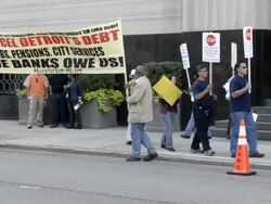 Protesters with banner at Detroit bankruptcy court Stock Footage