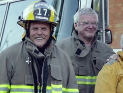 MS, PAN, Group of Volunteer Fire Fighters in Front of Fire Truck, Eastville, Virginia, USA Stock Footage