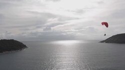 Paragliding at the beach Stock Footage