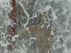 High Speed Boy running through wall of water, Spain. (Individual frames may also be used as a still image. Each frame in its raw state is about 6MB or about 12MB as a 16 bit TIFF) Stock Footage