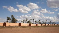Small clouds move over the medieval ramparts of the Old City of Marrakesh, Morocco. Stock Footage