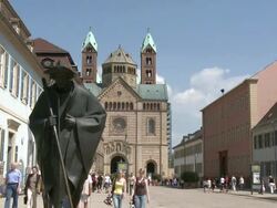 MS View of Speyer Cathedral and people walking on maximilanstreet / Speyer, Rhineland-Palatinate, Germany Stock Footage