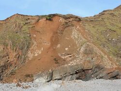 Rock face erosion at Welcombe Mouth beach, Cornwall, UK. Stock Footage