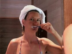 Young woman brushing her teeth Stock Footage