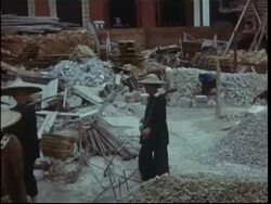 Hong Kong 1950; construction; manual labour on building site carrying bricks on yokes. Stock Footage