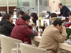 MS Shot of Bank account between Bank Teller and customer / Seoul, Seoul, South Korea Stock Footage