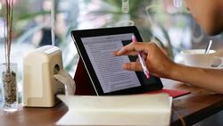 asian man using tablet searching internet browser in the cafe Stock Footage