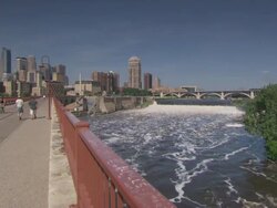 WS People walking on bridge near st anthony fall / Minneapolis, Minnesota, United States  Stock Footage