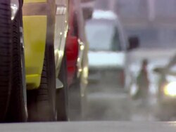 MS View of cabs tire and smoke coming into muffler / Minneapolis, Minnesota, United States Stock Footage