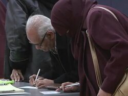 November 2, 2010 ZO Voters signing in to receive ballots for the midterm election / Dearborn, Michigan, United States Stock Footage