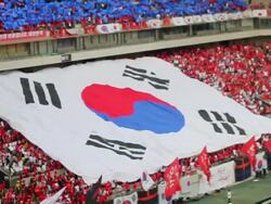 WS TD SLO MO View of Red Devil (Korean cheering squad) hand raised huge South Korean Flag to spread at the Seoul World Cup Stadium in Sangam / Seoul, South Korea  Stock Footage