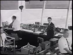 1966: AIR TRAFFIC: VS Controllers inside Air Traffic Control Tower (TWR), ZI Man using binoculars, WS ZI TRACKING Commercial DC-8 passenger jet taking off, ascending right. RADAR CONTROLLERS: VS Sweeping display of aircraft, controllers in dark room. Instructional Video