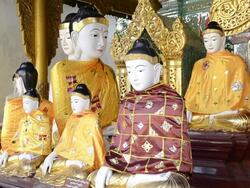 MS Buddha statues wearing colorful robes in shwedagon pagoda / Yangon, Yangon Division, Myanmar Stock Footage