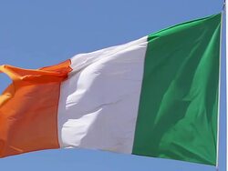 CU SLO MO Irish flag waving in wind / Caen, Normandy, France Stock Footage
