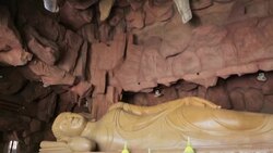 Cave with sleeping Buddha statue inside in Thailand Stock Footage