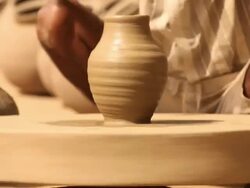 Man rotating potter's wheel, Faridabad, Haryana, India Stock Footage