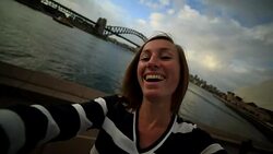 Young woman in Sydney harbour, takes a selfie portrait Stock Footage