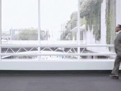  WS Businessman running through lobby of building pulling a rolling briefcase / Seattle, Washington, United States Stock Footage